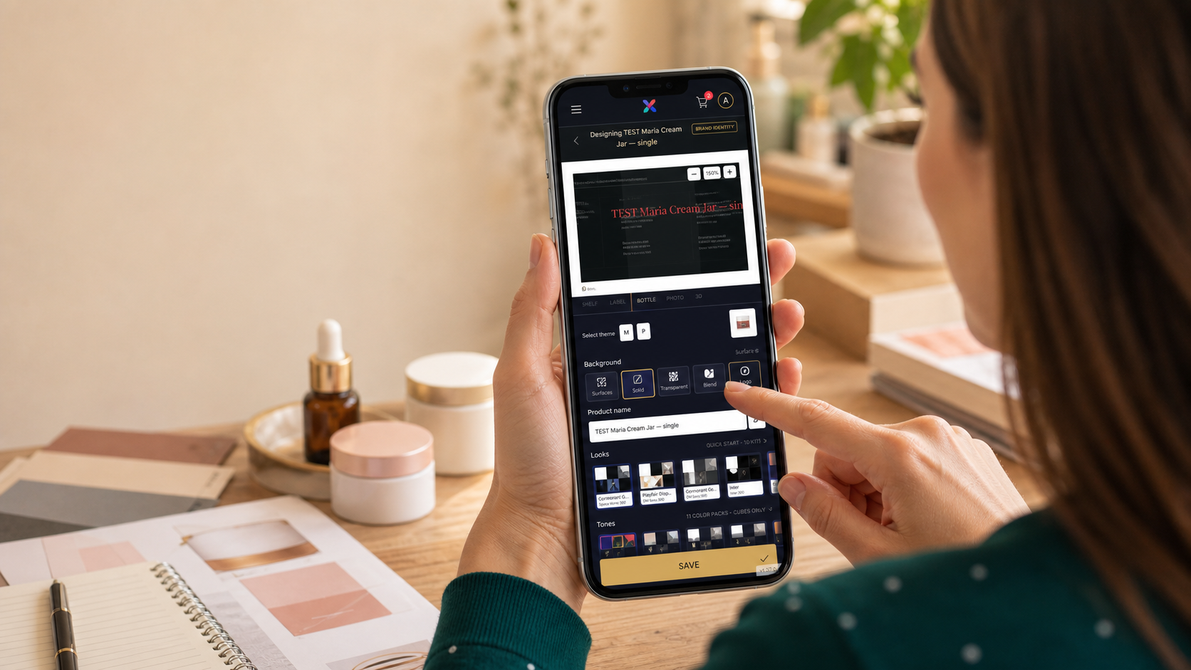 A creator designing her brand label and packaging in the app on her phone
